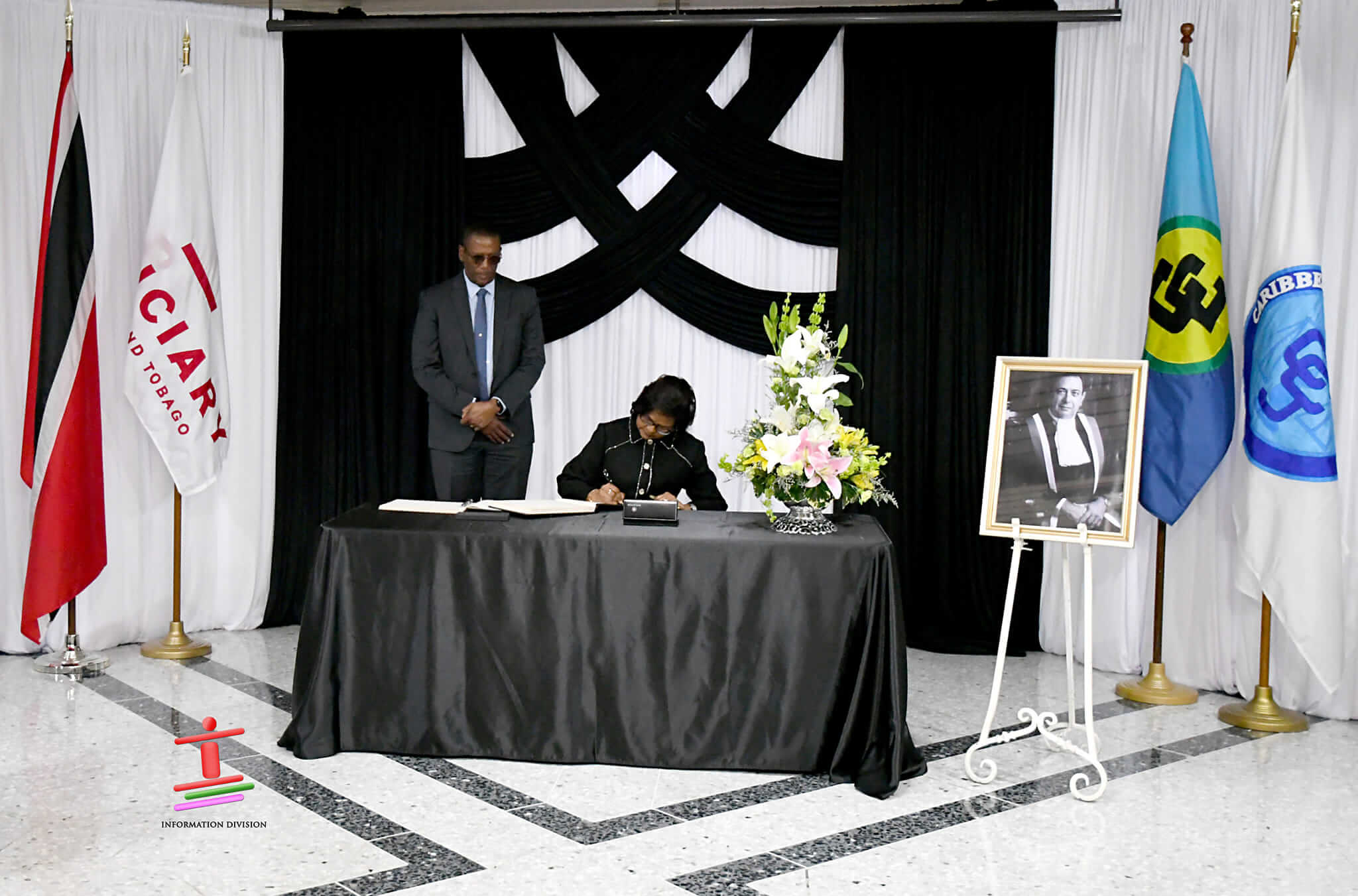 Her Excellency signs Condolence Book for former Chief Justice, Mr. Justice Michael Anthony de la Bastide TC.
