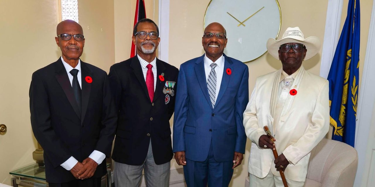His Excellency Wade Mark, Acting President receives the first Poppy