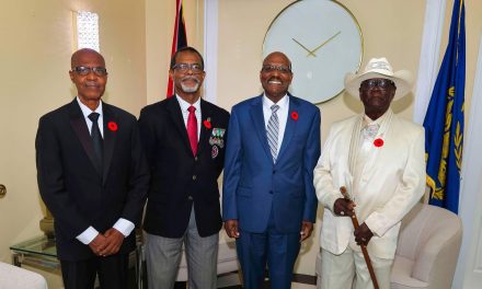 His Excellency Wade Mark, Acting President receives the first Poppy